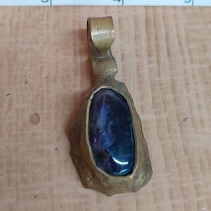 Elegant Brass Pendant with Dark Blue Stone